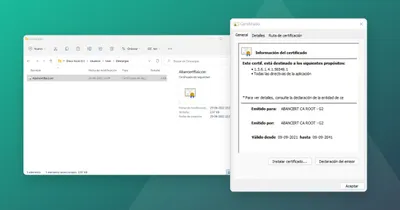 Ventana de Windows con el certificado raíz ABANCERT CA ROOT - G2, junto al archivo AbancertRaiz.cer en la carpeta Descargas
